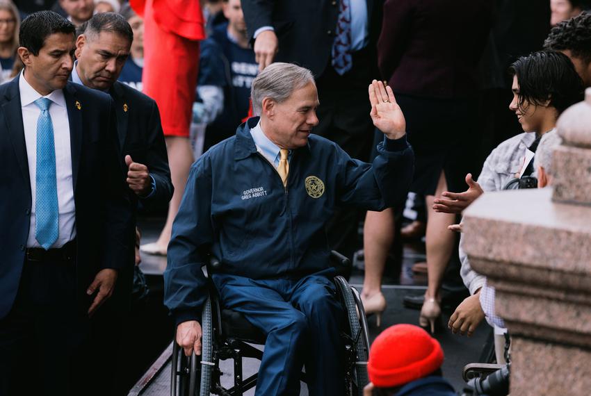 Gov. Greg Abbott high fives a young supporter after delivering a speech at a Parent Empowerment Day event at the Capitol on March 21, 2023.
