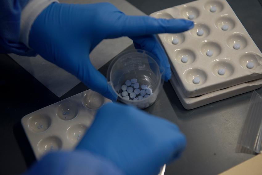 Angelica Noyola, a forensic analyst in the seized drugs lab, prepares a tray of pills, which likely contain oxycodone, for a chemical spot test as the state grapples with the effects of the nation's growing opioid epidemic at the Houston Forensic Science Center in Houston on March 29, 2023.