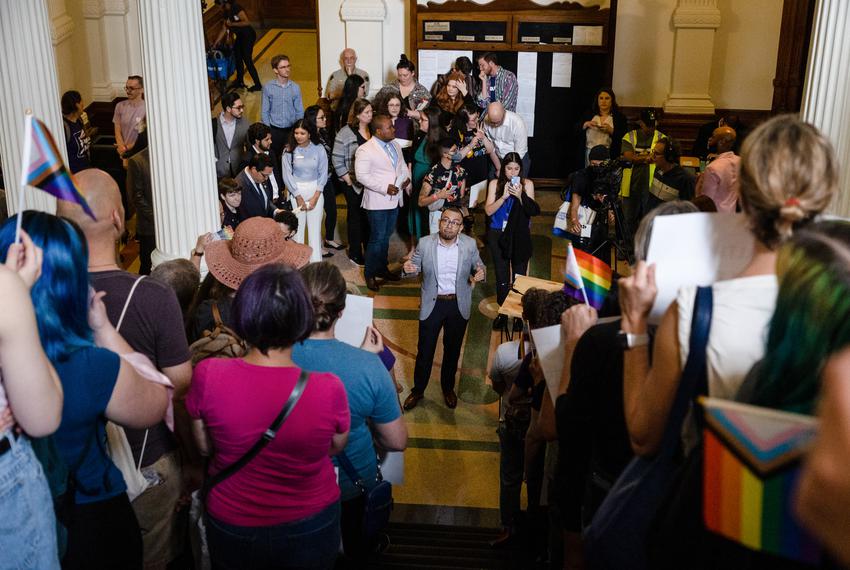 Ricardo Martinez, CEO of Equality Texas, gives instructions regarding a press conference to people who have gathered on the stairs across from the House floor to protest against SB 14, which seeks to ban puberty blockers and hormone therapies for transgender youth, before it is heard for debate in the House at the state Capitol in Austin on May 12, 2023.