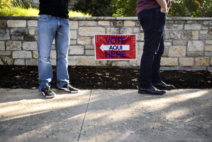 Voters wait in line at a polling site at Austin Oaks Church on Oct. 14, 2020.