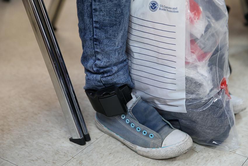 After being detained and released by law enforcement, an undocumented immigrant wears an ankle monitor at the Catholic Charities relief center in McAllen on April 6, 2018.