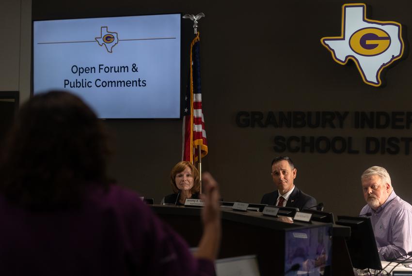 The superintendent of the Granbury Independent School District, Jeremy Glenn, second from right, at a school board meeting in March. He was secretly recorded ordering librarians to remove LGBTQ-themed library books.