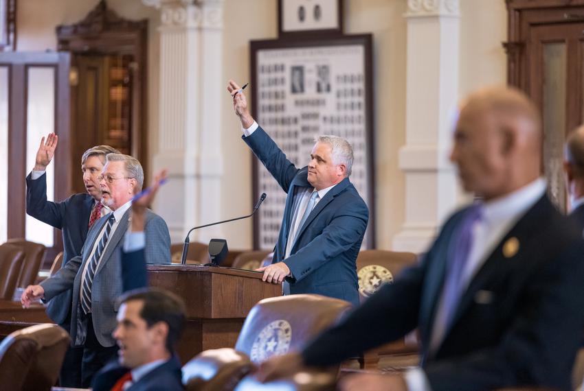 State Rep. Bryan Slaton, R-Royse City, waits to speak from the back podium on the House floor on Monday, August 9, 2021.