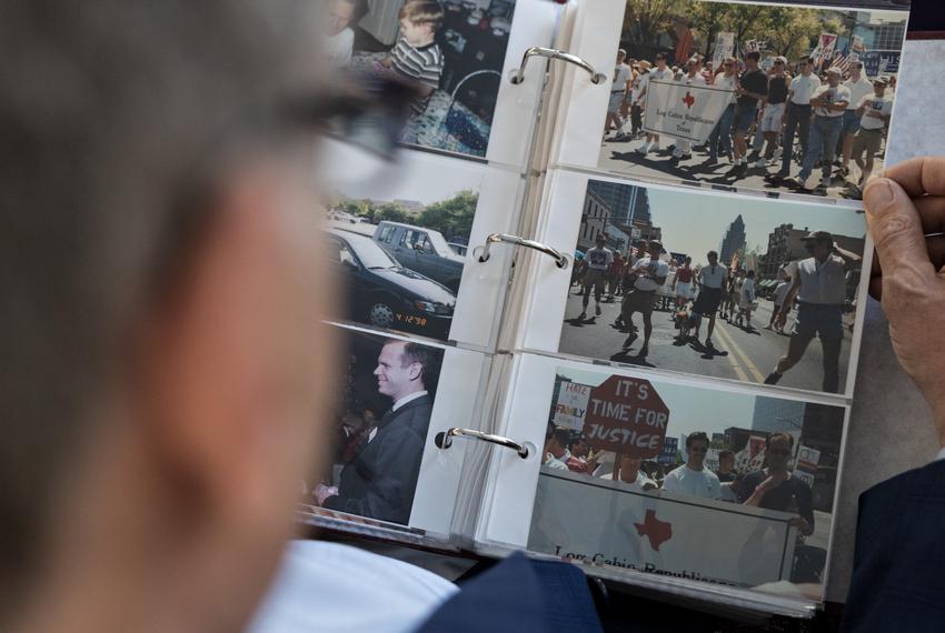 Dale Carpenter looks through photos from the 1998 Hate Crimes March in Austin in his home in Dallas, TX on July 8, 2022.