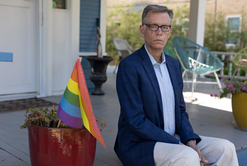 Dale Carpenter poses for a portrait outside of his home in Dallas, TX on July 8, 2022. In the 1990s Carpenter was the state president of the Log Cabin Republicans, an organization that represents LGBT conservatives, but has since distanced himself from party politics.