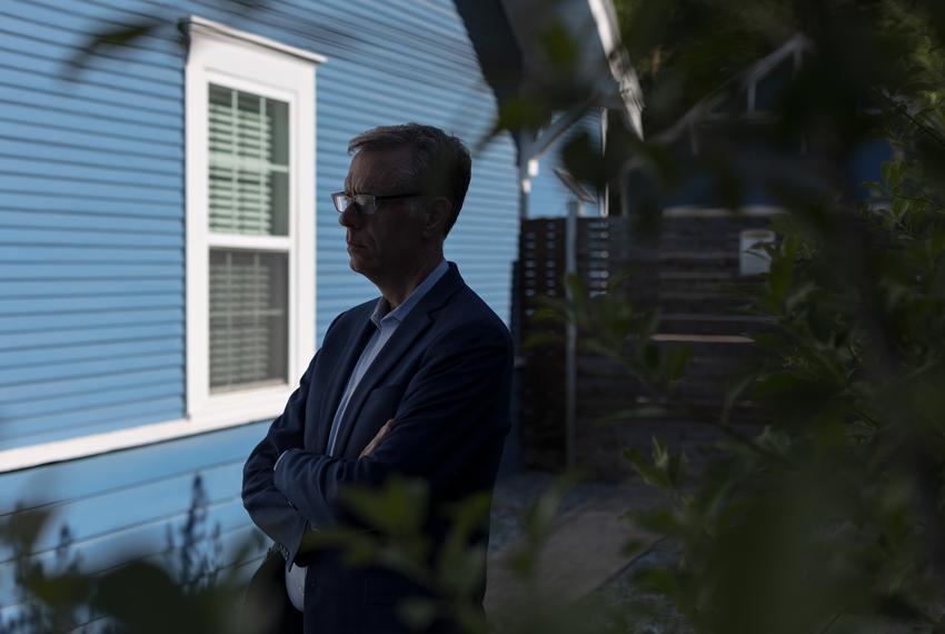 Dale Carpenter poses for a portrait outside of his home in Dallas, TX on July 8, 2022. In the 1990s Carpenter was the state president of the Log Cabin Republicans, an organization that represents LGBT conservatives, but has since distanced himself from party politics.