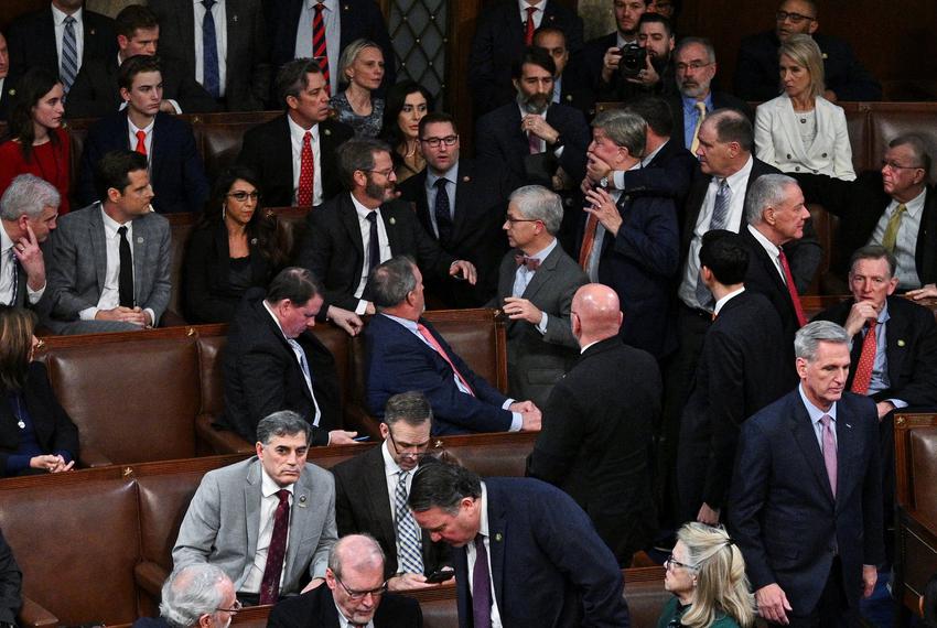 A member-elect of the House of Representatives grabs Mike Rogers, R-Alabama, by the face as Kevin McCarthy walks away. Rogers had approached Matt Gaetz, R-Florida, and members of the House Freedom Caucus after Gaetz voted "present" rather than voting for McCarthy in a late-night 14th round of voting for a new House Speaker on Jan. 6, 2023.