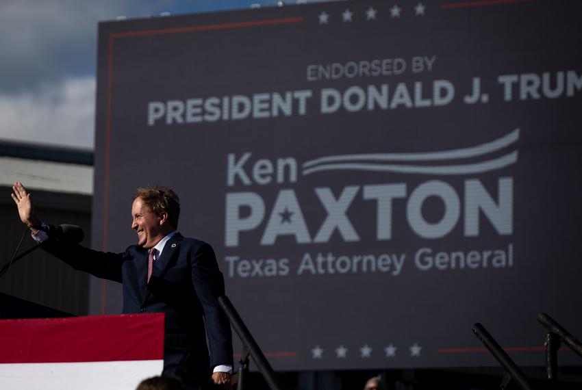 Texas Attorney General Ken Paxton waves as he walks on stage at a Texas Trump rally at the Richard M. Borchard Regional Fairgrounds on Oct. 22. 2022, in Robstown.