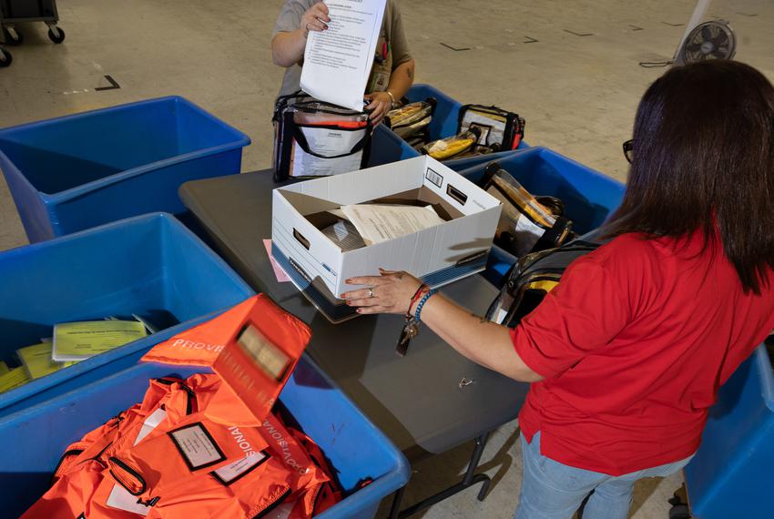 Election workers sort provisional ballots and forms from the polling centers at the Tarrant County Election Administration building in Fort Worth on November 8, 2022.