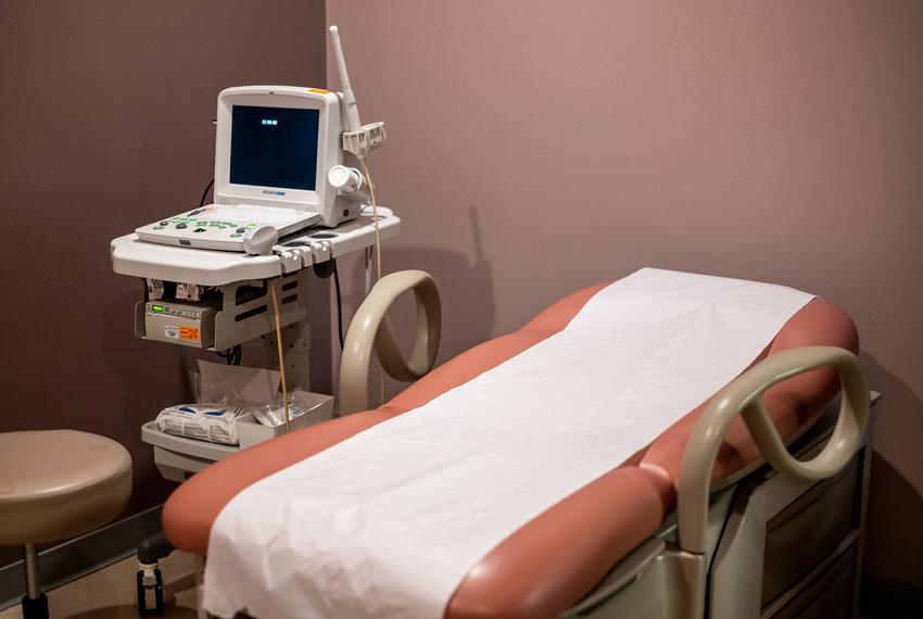 An ultrasound machine sits next to an empty patient bed at Whole Women’s Health of Austin on Sept.1, 2021.